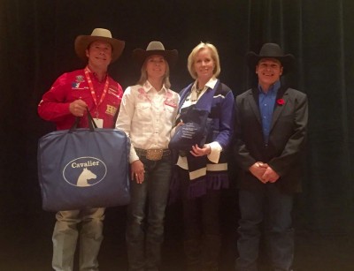 From left to right Scott Byrne presenting Nancy along with the BJ Memorial sponsors Marci and Billy Laye.